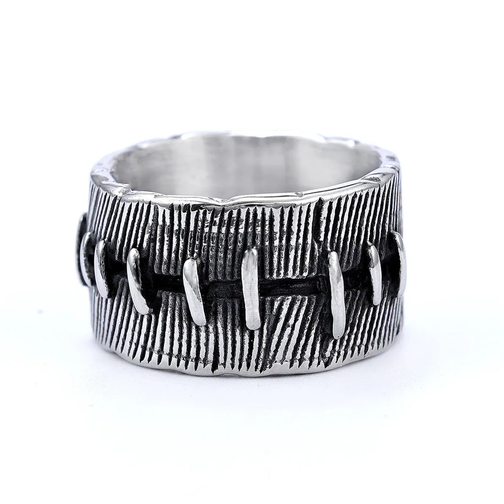 Dark punk geometric U-shaped double ring in titanium steel on a solid background