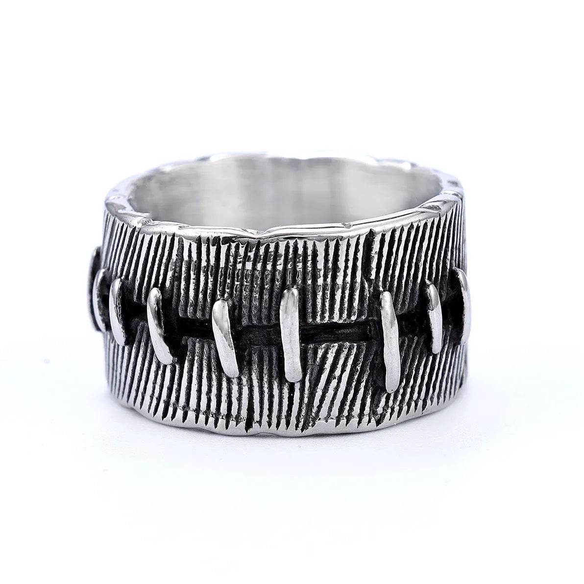 Dark punk geometric U-shaped double ring in titanium steel on a solid background