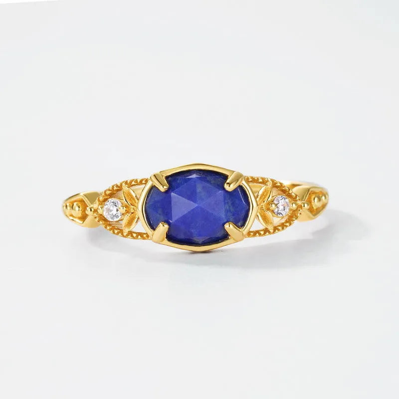 Geometric ellipse lapis lazuli silver ring with Japanese style design on a model's hand.