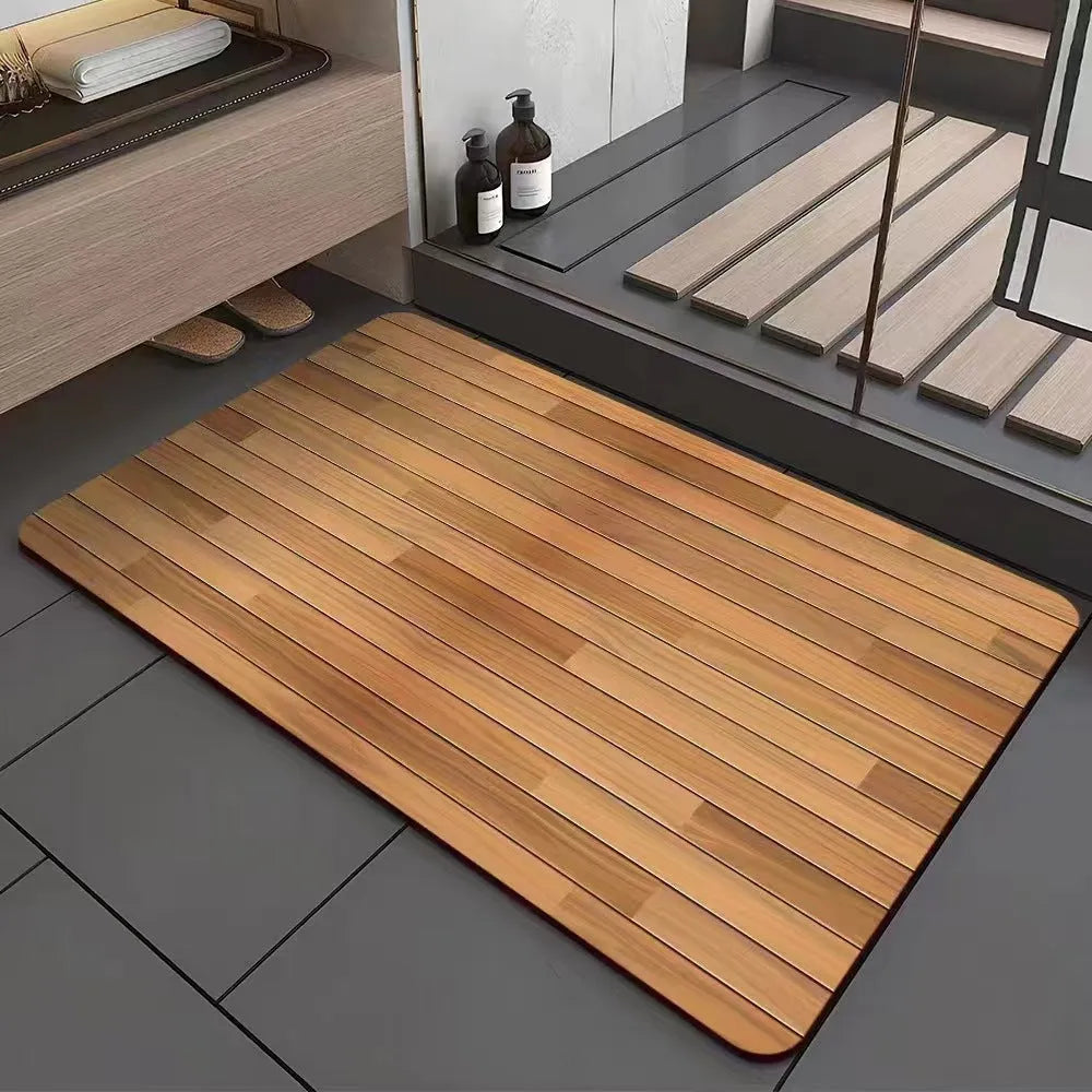 Square diatomite bathroom floor mat with geometric print in a wood grain colour on a tiled floor.