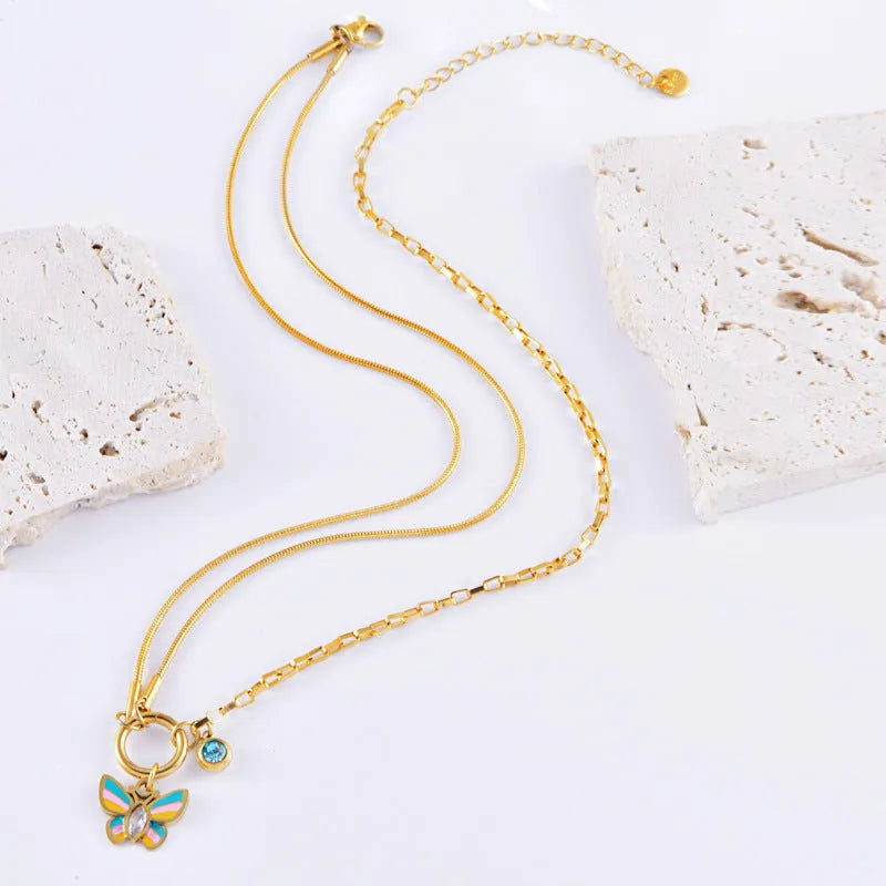 Gold titanium steel butterfly jewellery set with colourful epoxy pendant on snake bones chain necklace and bracelet
