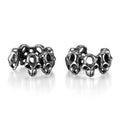 Steel hollow skull earrings with geometric design and ear clip fitting