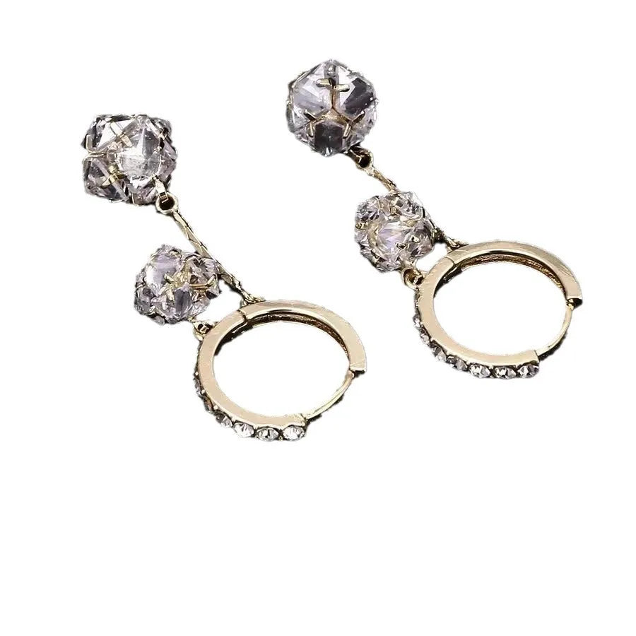 Women's silver drop earrings with confession balloon and rhinestone ball pendants connected by tassel detailing
