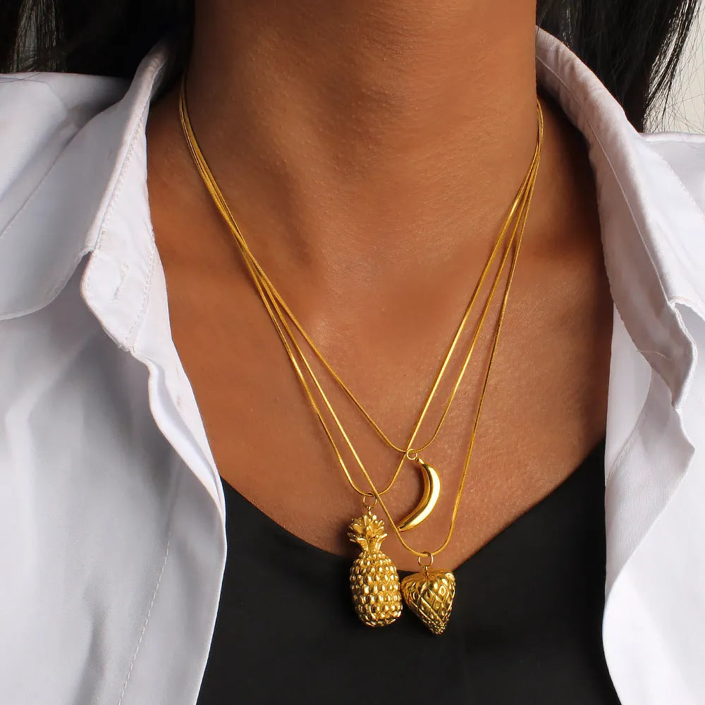 Stainless steel necklace with a detailed alloy fruit pendant charm.