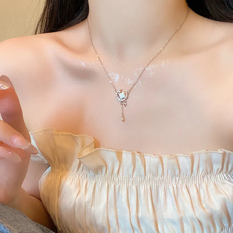 Women's star moon necklace with zirconium accents on adjustable chain in gold or silver finish
