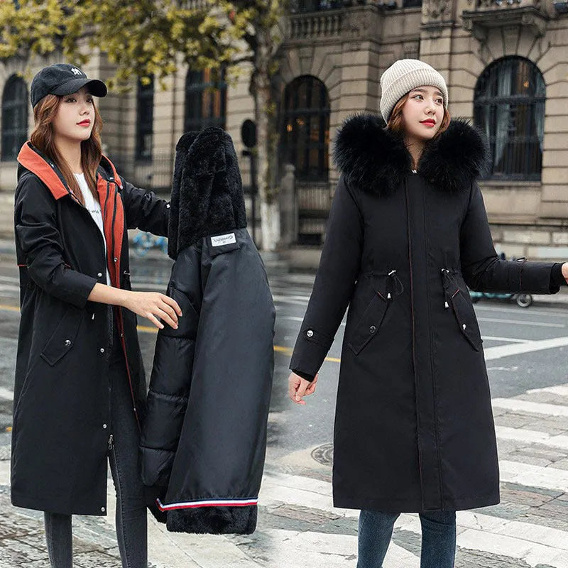 Women's long beige trench coat with fleece lining on a hanger, showing its extended length and elegant style.