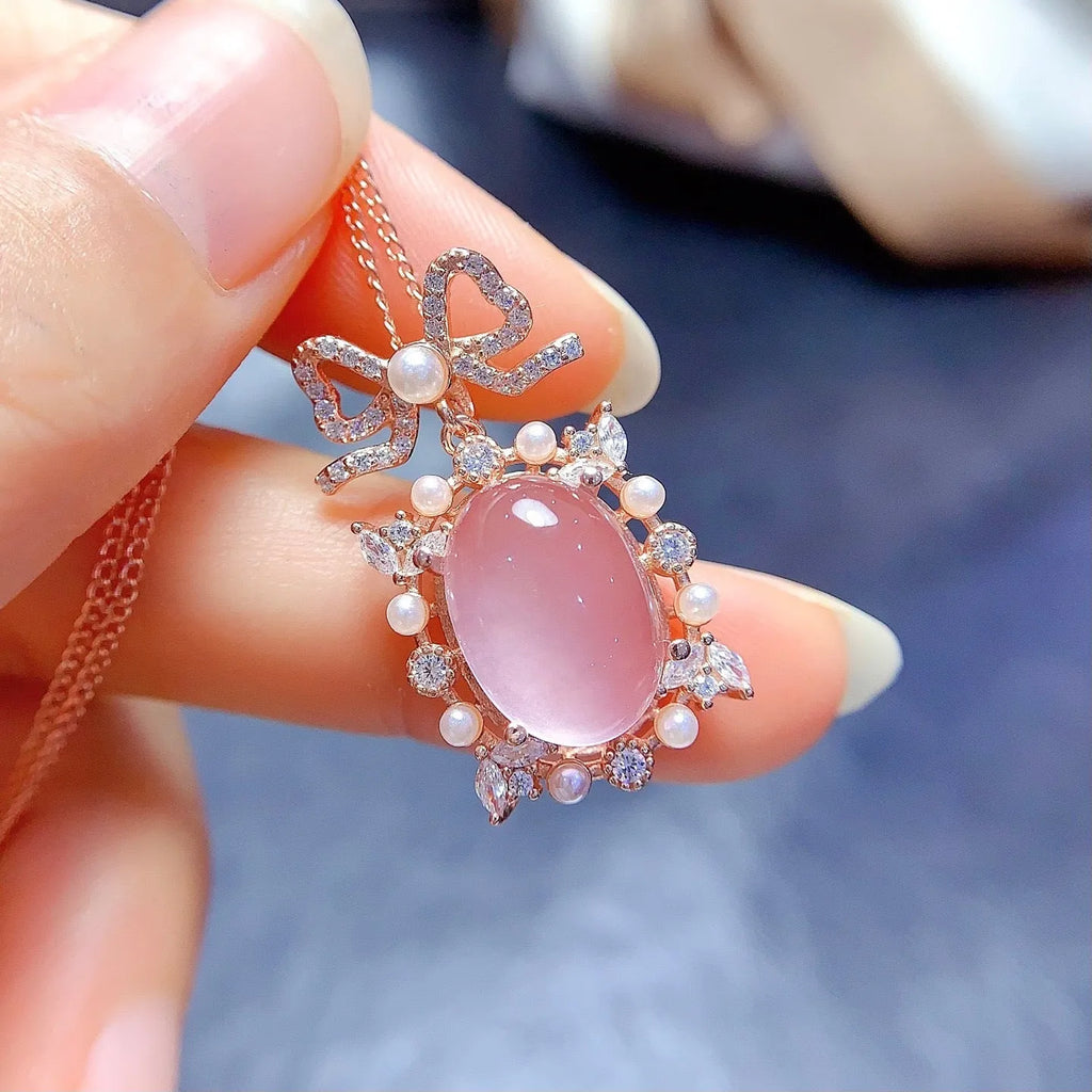 Geometric pink rose quartz pendant on silver necklace with rose gold plating
