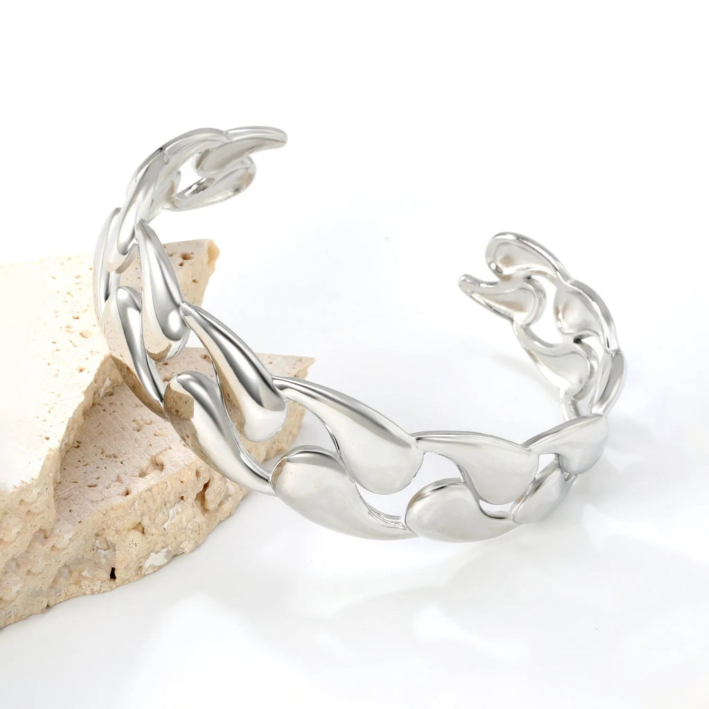 Advanced stainless steel alloy bracelet in European and American style on a wrist, showing a metallic finish.