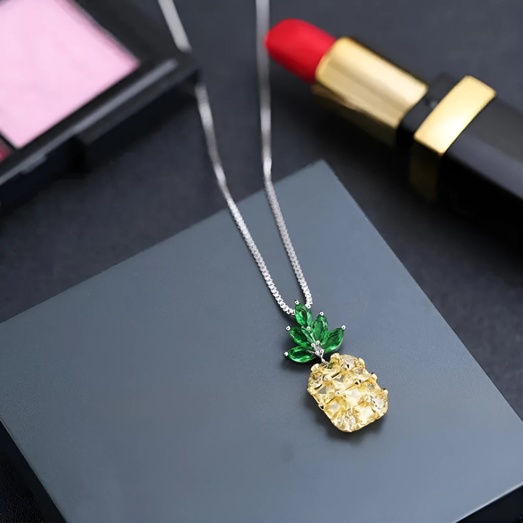 Silver geometric pineapple diamond pendant necklace on an adjustable chain.