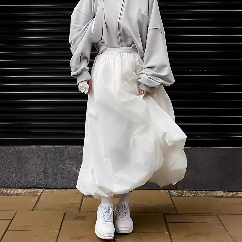 Women's long solid colour cotton skirt on a hanger, showing elasticated waist.
