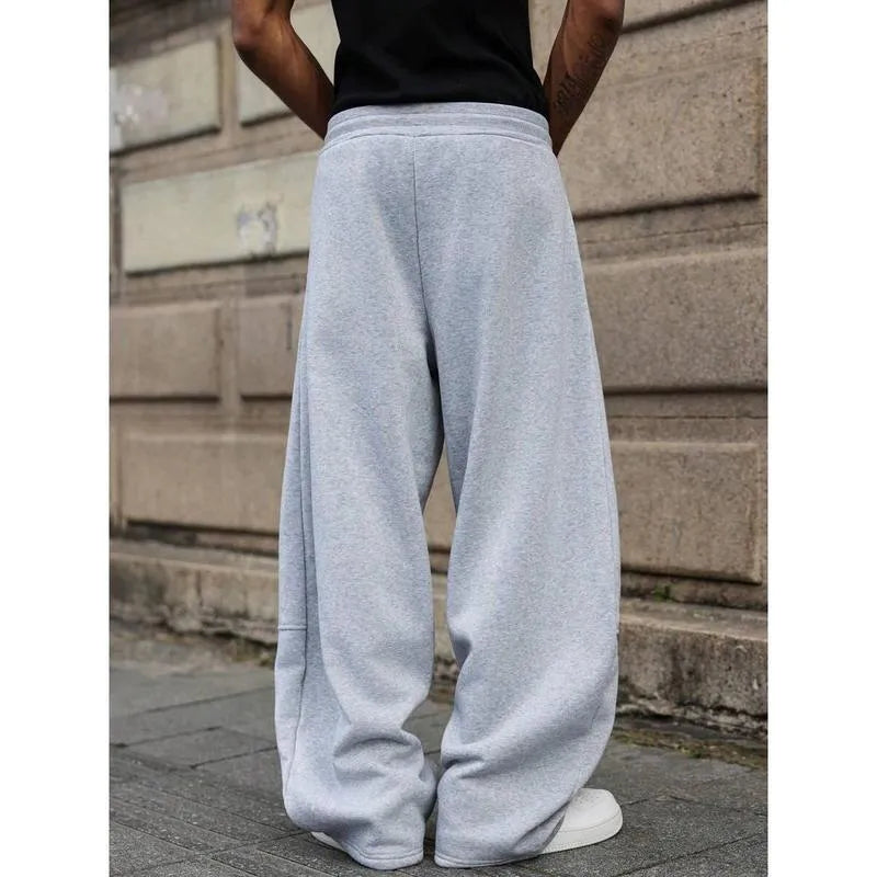 Men's straight leg high waist casual trousers in a grey colour with a cropped length and elasticated waistband.