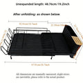 Retractable foldable kitchen dish drain rack for cutlery and cups on a countertop.