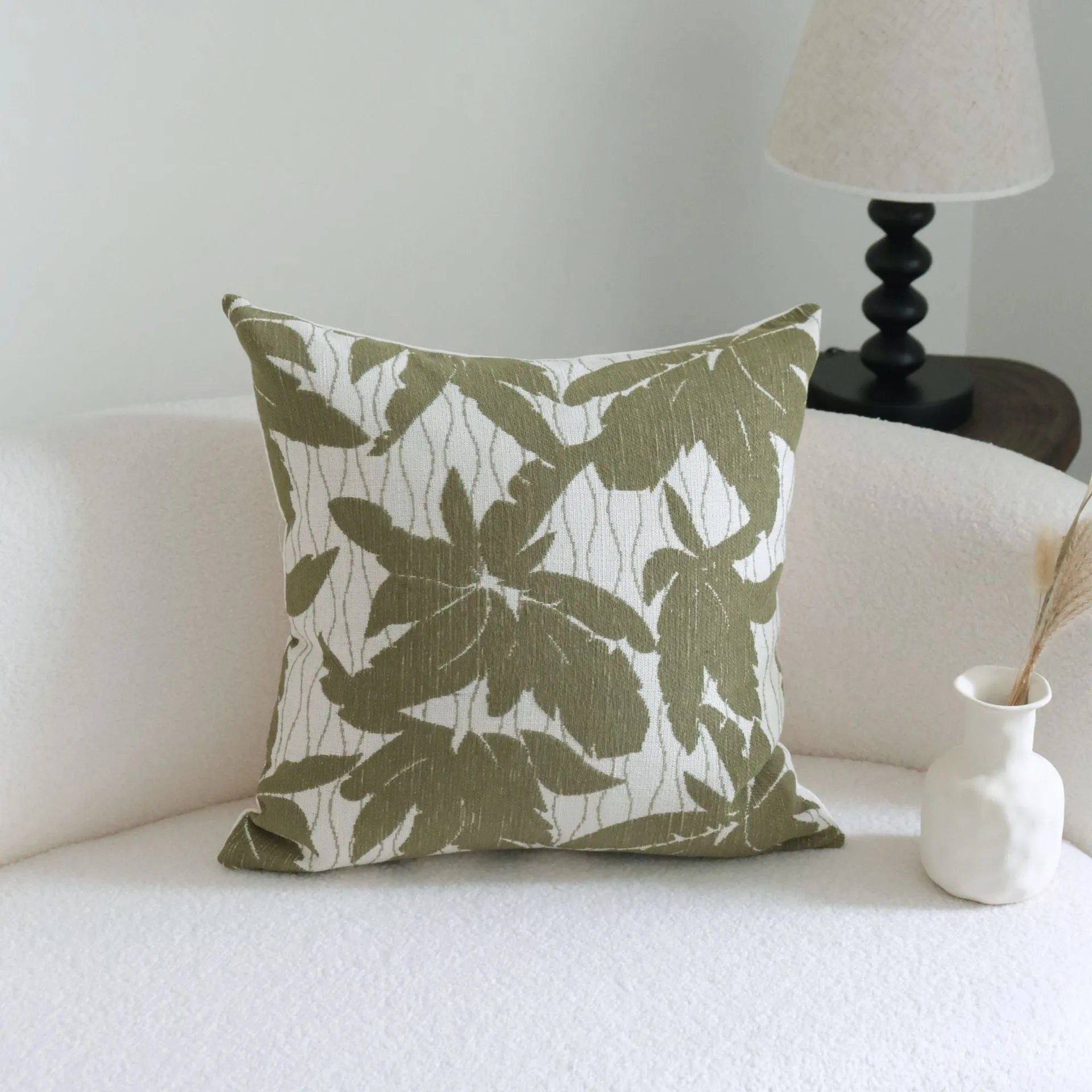 Green cotton and linen tassel hotel sample pillow with botanical pattern on brushed fabric pillowcase
