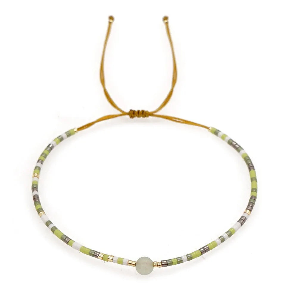 Women's handmade bohemian bracelet with semi-precious stone bead and colourful glass beads.