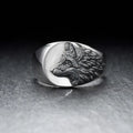 Men's silver geometric wolf ring with retro domineering shape on a hand.