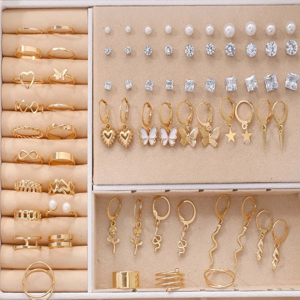 108 geometric pearl earrings with gold electroplated alloy construction and round elements