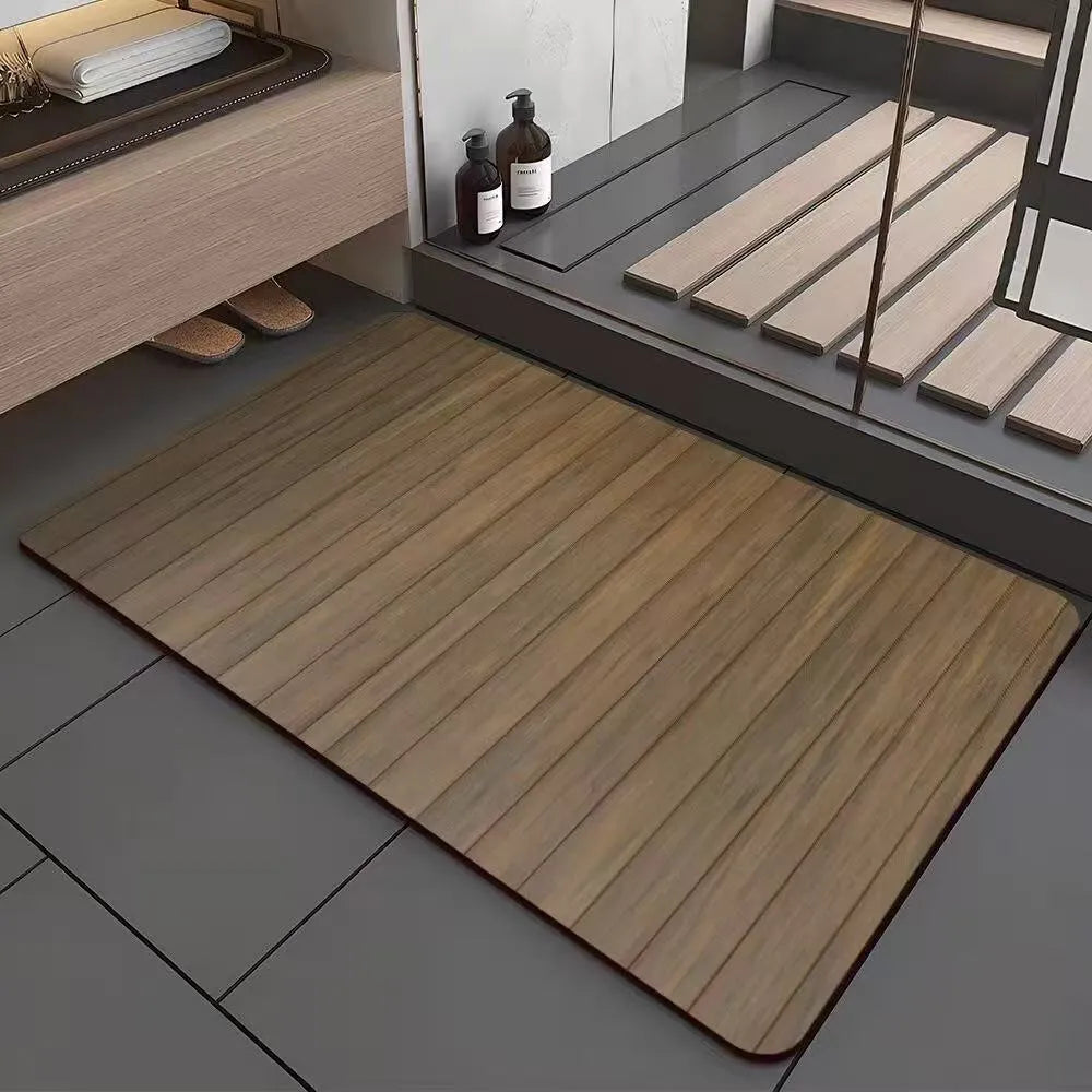 Square diatomite bathroom floor mat with geometric print in a wood grain colour on a tiled floor.
