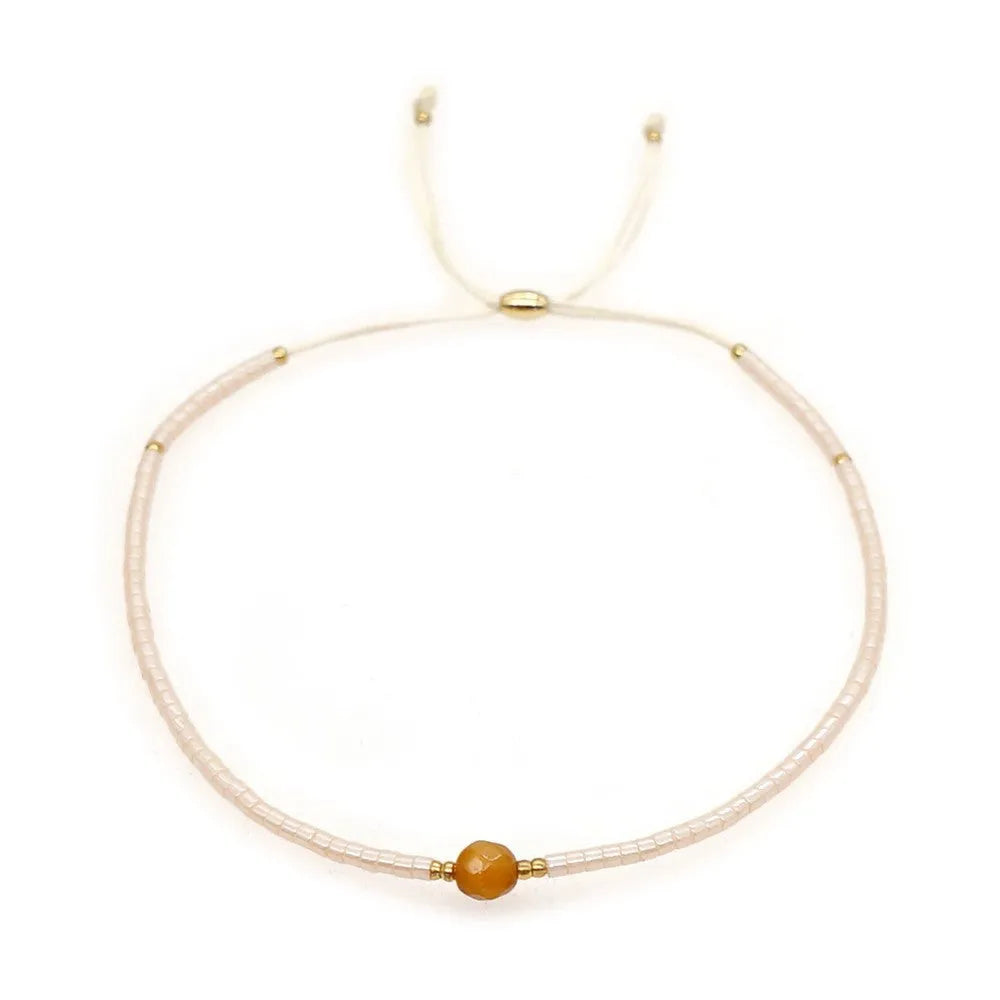Women's handmade bohemian bracelet with semi-precious stone bead and colourful glass beads.