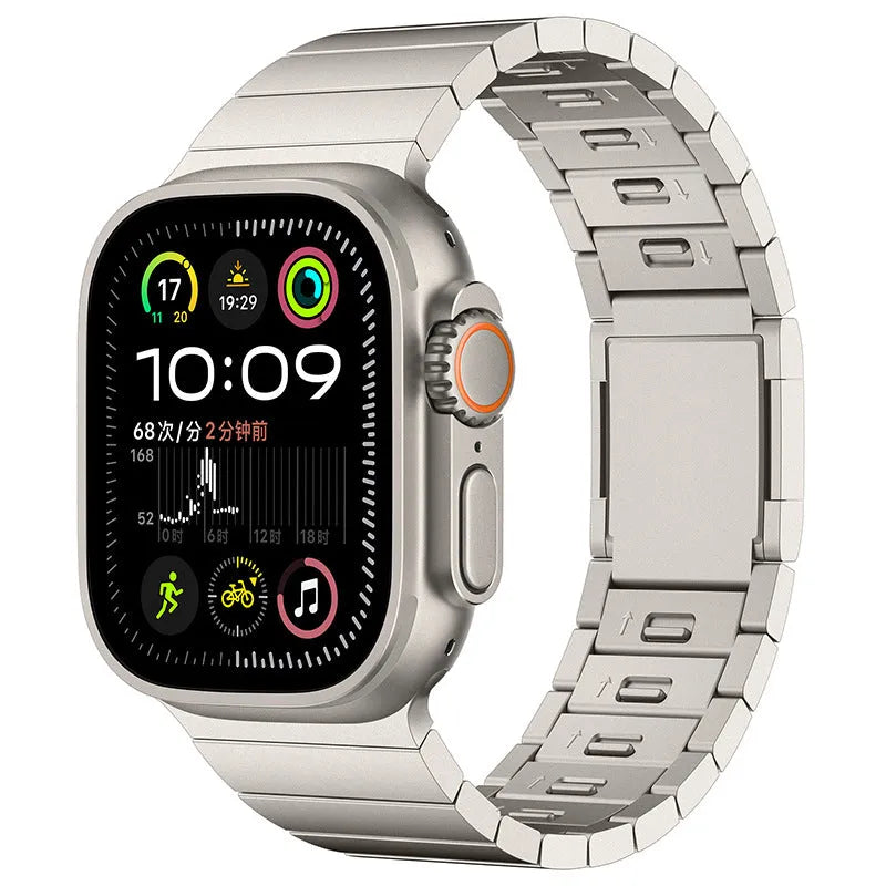 Silver stainless steel magnetic buckle strap for an Apple Watch on a wrist