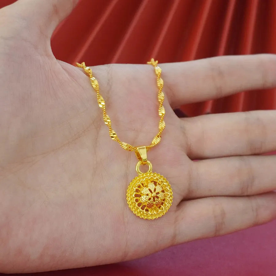 Gold-plated three-piece jewelry set showing necklace, earrings, and ring with a detailed flower design pendant.