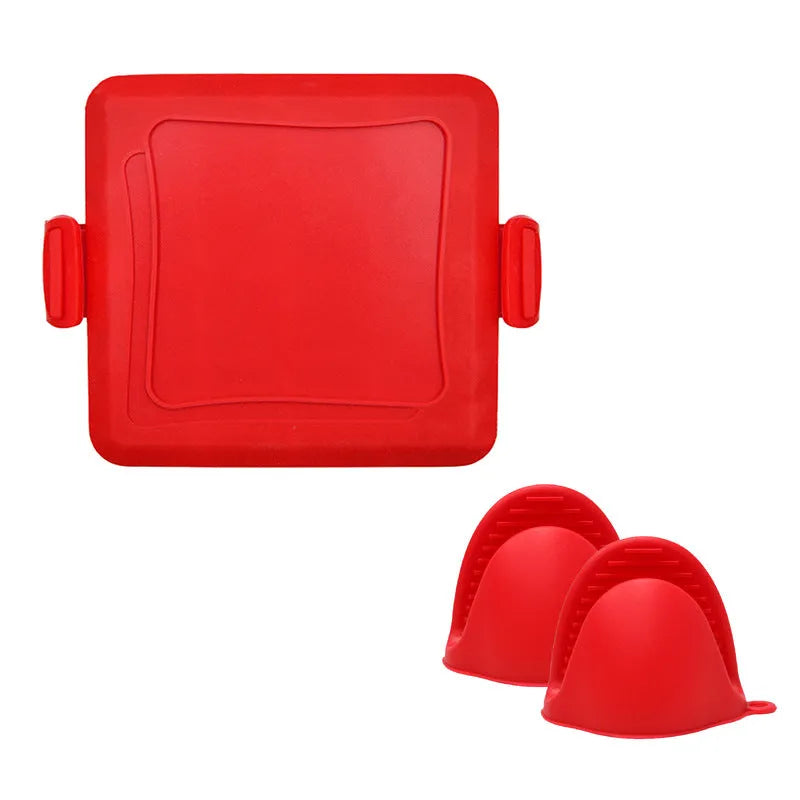 Red silicone baking tray with matching heat-resistant gloves on a kitchen counter.