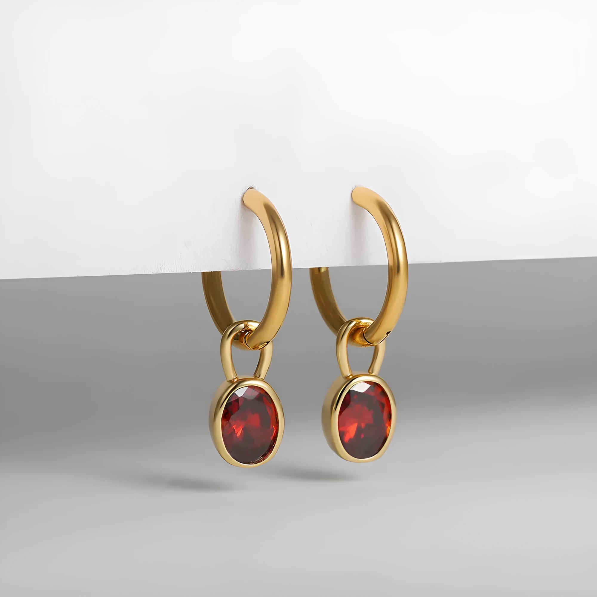 Women's oval zircon earrings in retro copper setting, showing colour options: white, emerald, green, black, red, blue.