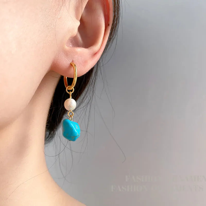 Turquoise and cultured pearl ear clip earrings in irregular geometric shape, shown in both short and long dangle styles