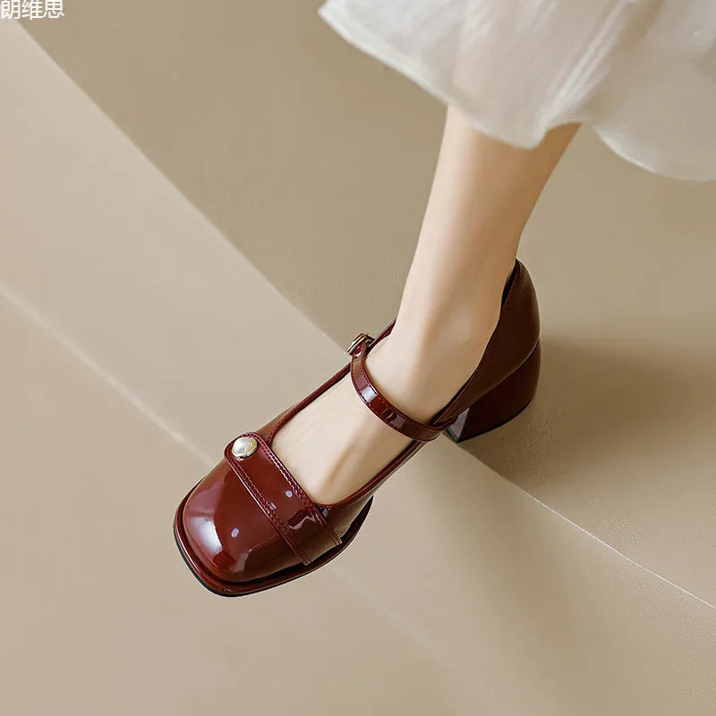 Plus size women's patent leather chunky heel pumps with square toe and buckle fastening in apricot colour.