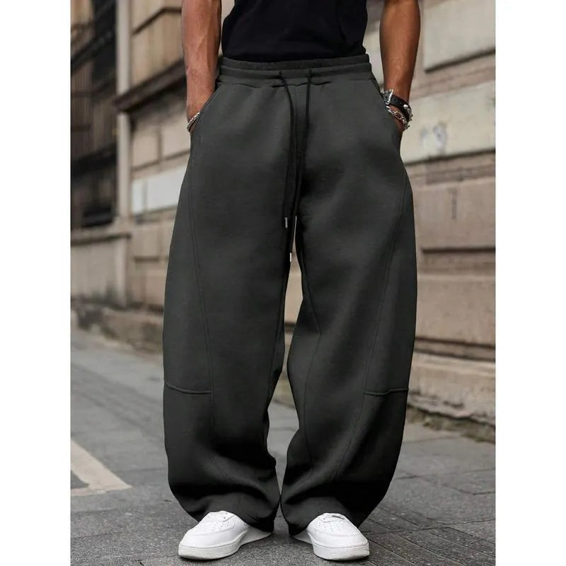Men's straight leg high waist casual trousers in a grey colour with a cropped length and elasticated waistband.