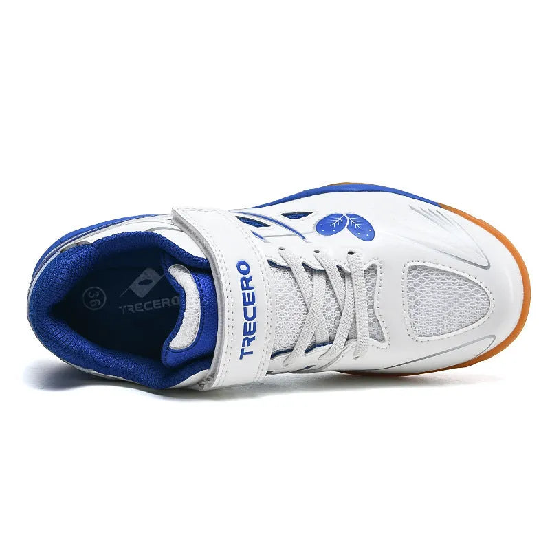 White and blue low top badminton shoes with a ribbed sole and breathable PVC upper.