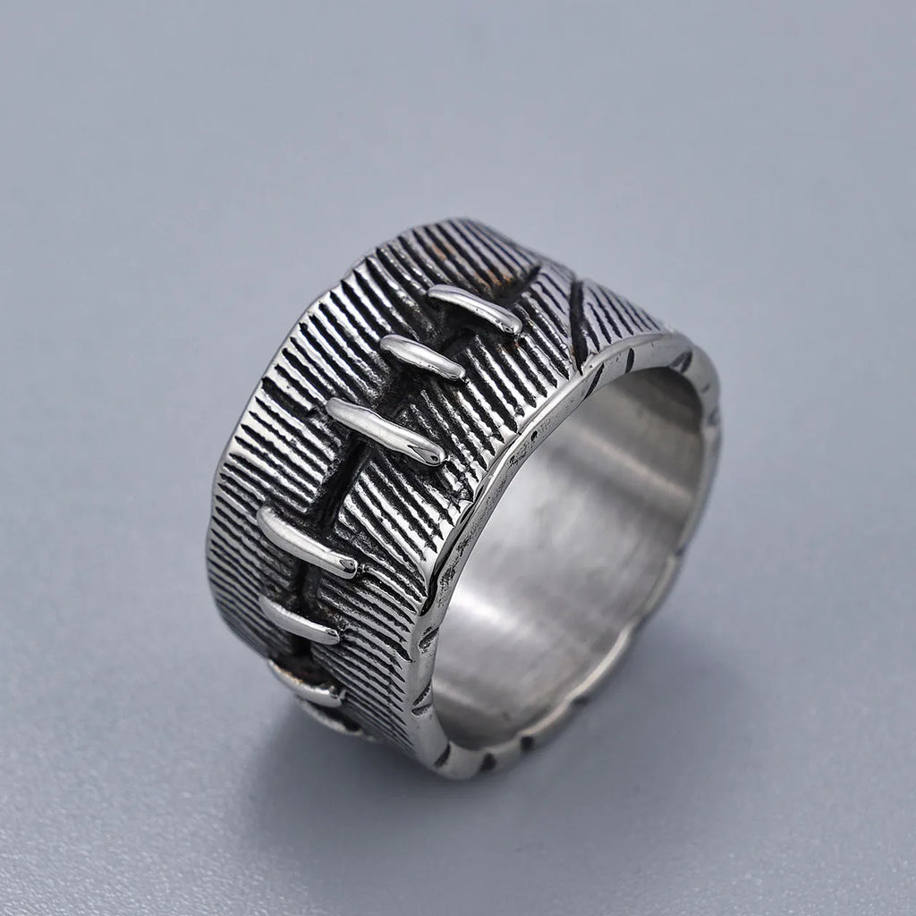 Dark punk geometric U-shaped double ring in titanium steel on a solid background