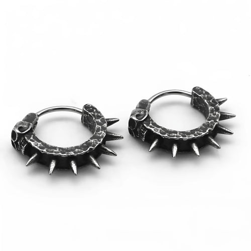 A pair of black alloy earrings with a geometric motorcycle punk design on a white background.