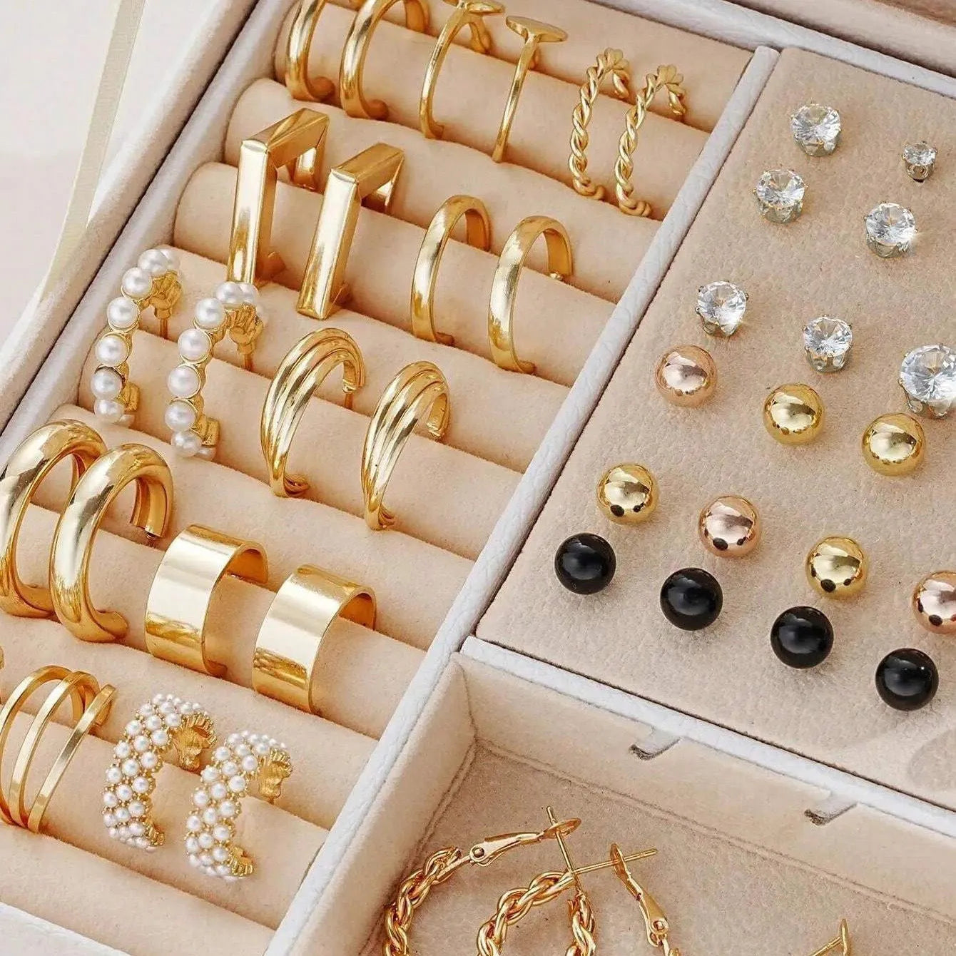 108 geometric pearl earrings with gold electroplated alloy construction and round elements