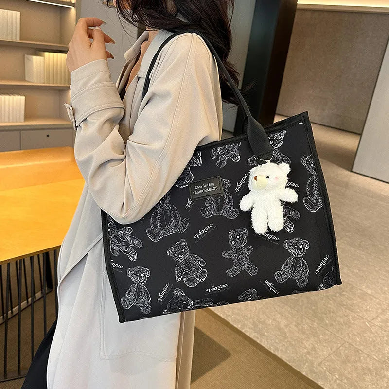 Women's black and white canvas tote bag with rhombus pattern and horizontal square shape