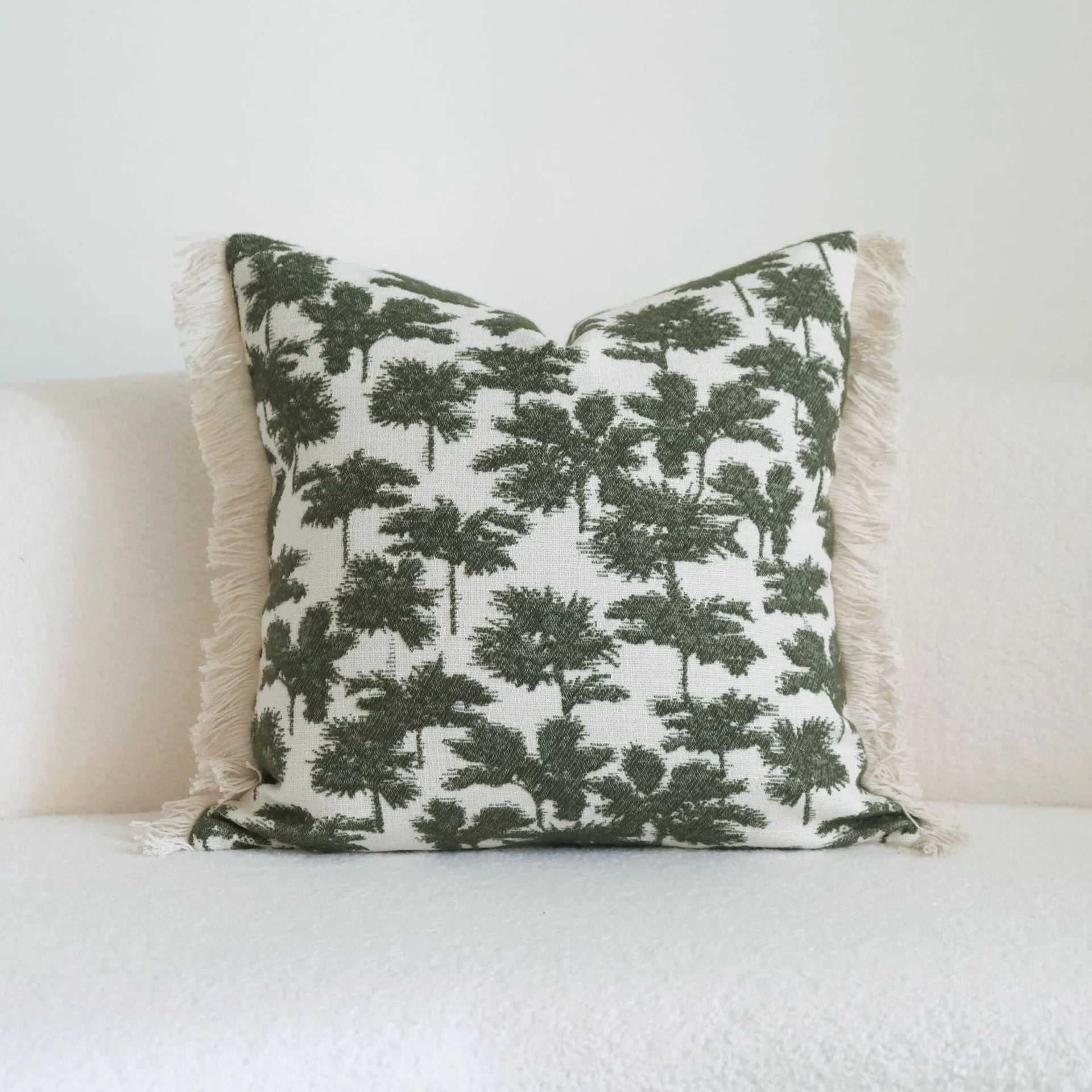 Green cotton and linen tassel hotel sample pillow with botanical pattern on brushed fabric pillowcase