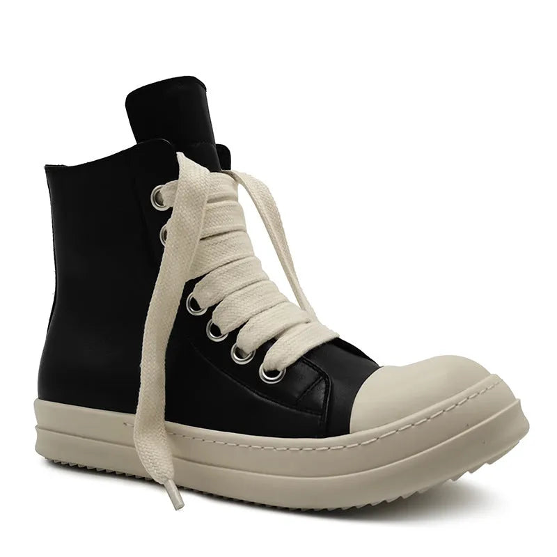 Black high-top leather sneakers with side zipper on a white background.