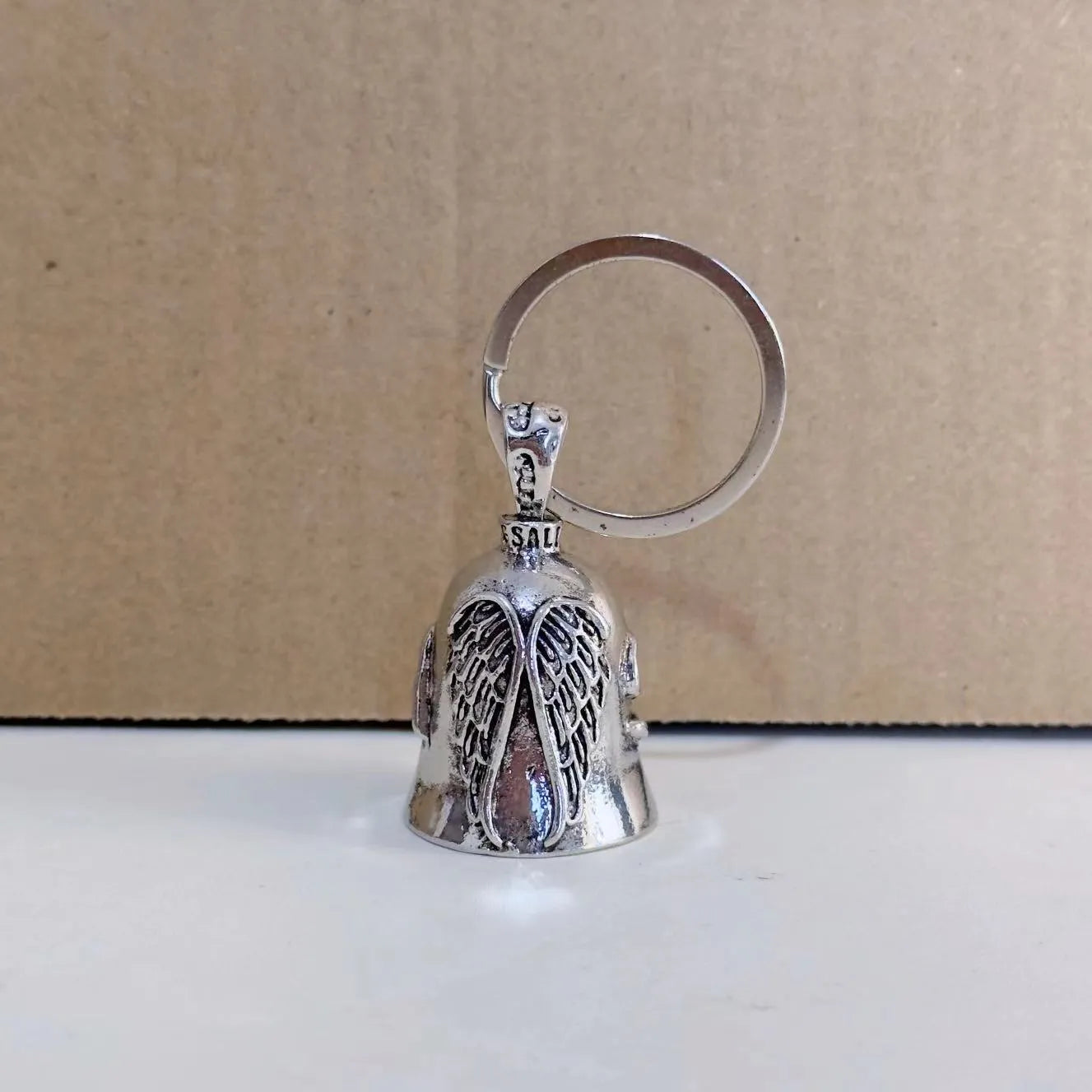 Silver-tone vintage angel feather and wings design necklace pendant and matching keychain.