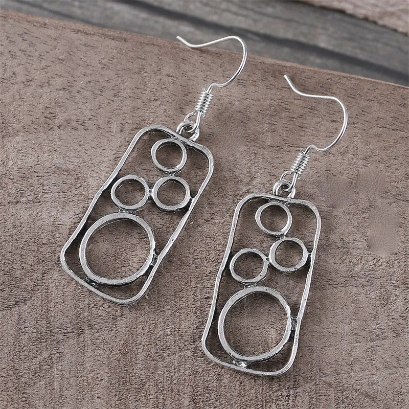 Geometric alloy earrings with round ring design and irregular square shape in antique silver colour