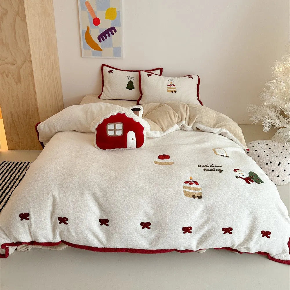 Winter Christmas cartoon print bed linen four-piece set showing fitted sheet, duvet cover, and pillowcases.