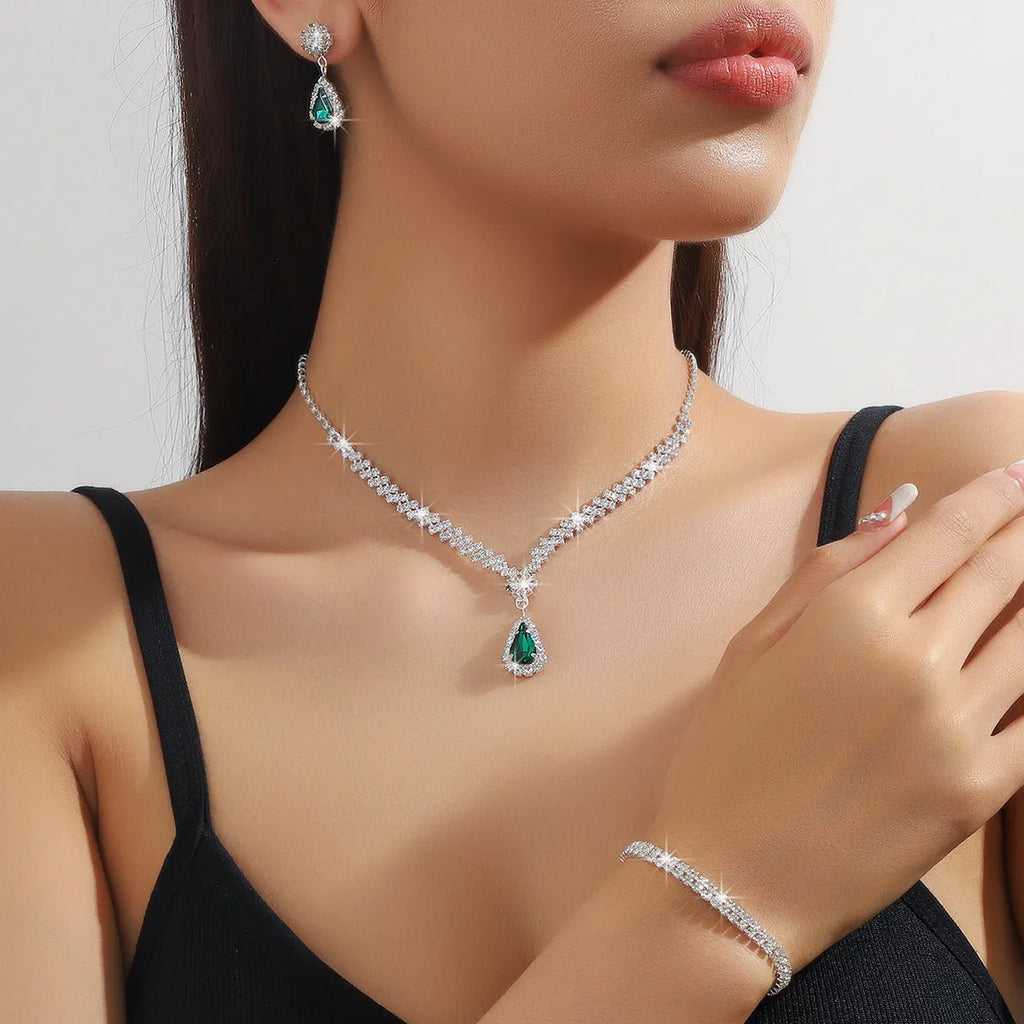 Claw chain rhinestone jewellery set with drop-shaped stones in multiple colour options
