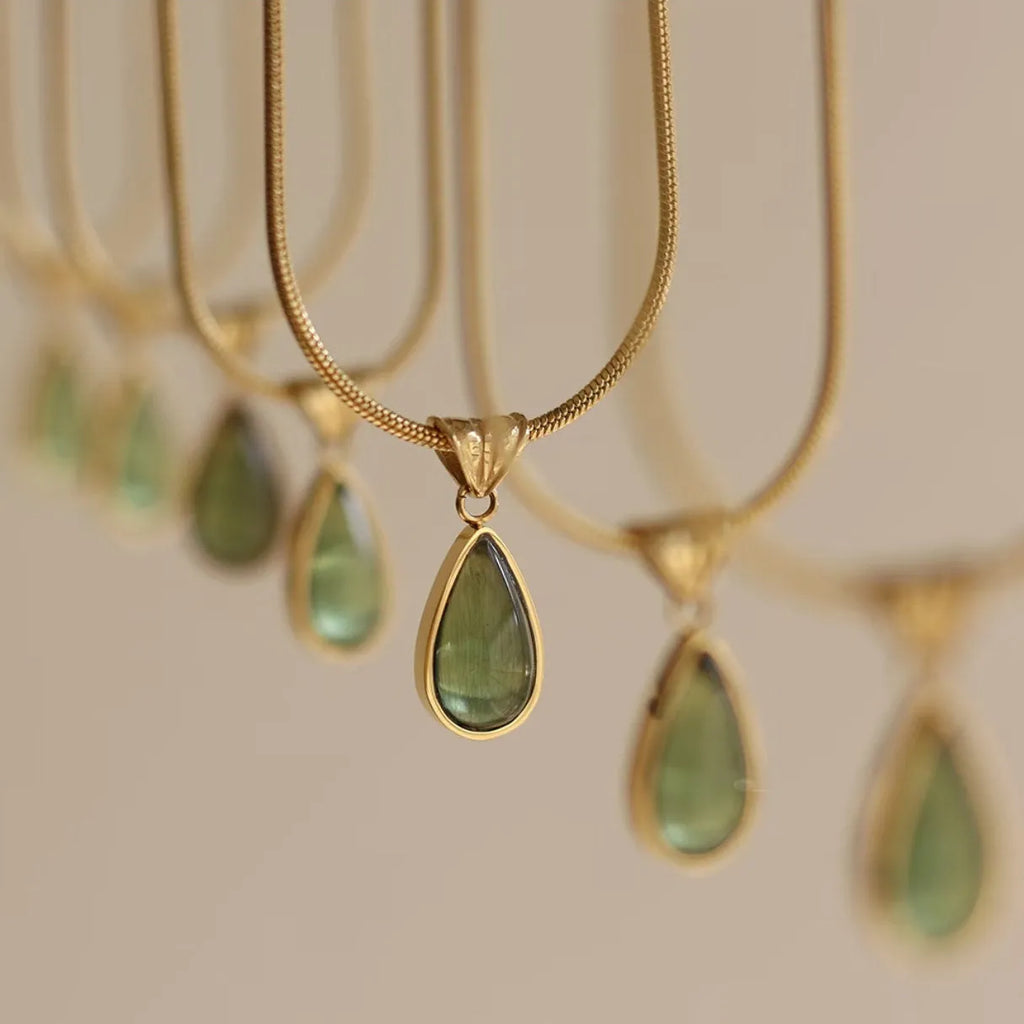 Water drop necklace with mixed gem pendant on titanium snake chain in blue or green.