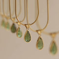 Water drop necklace with mixed gem pendant on titanium snake chain in blue or green.