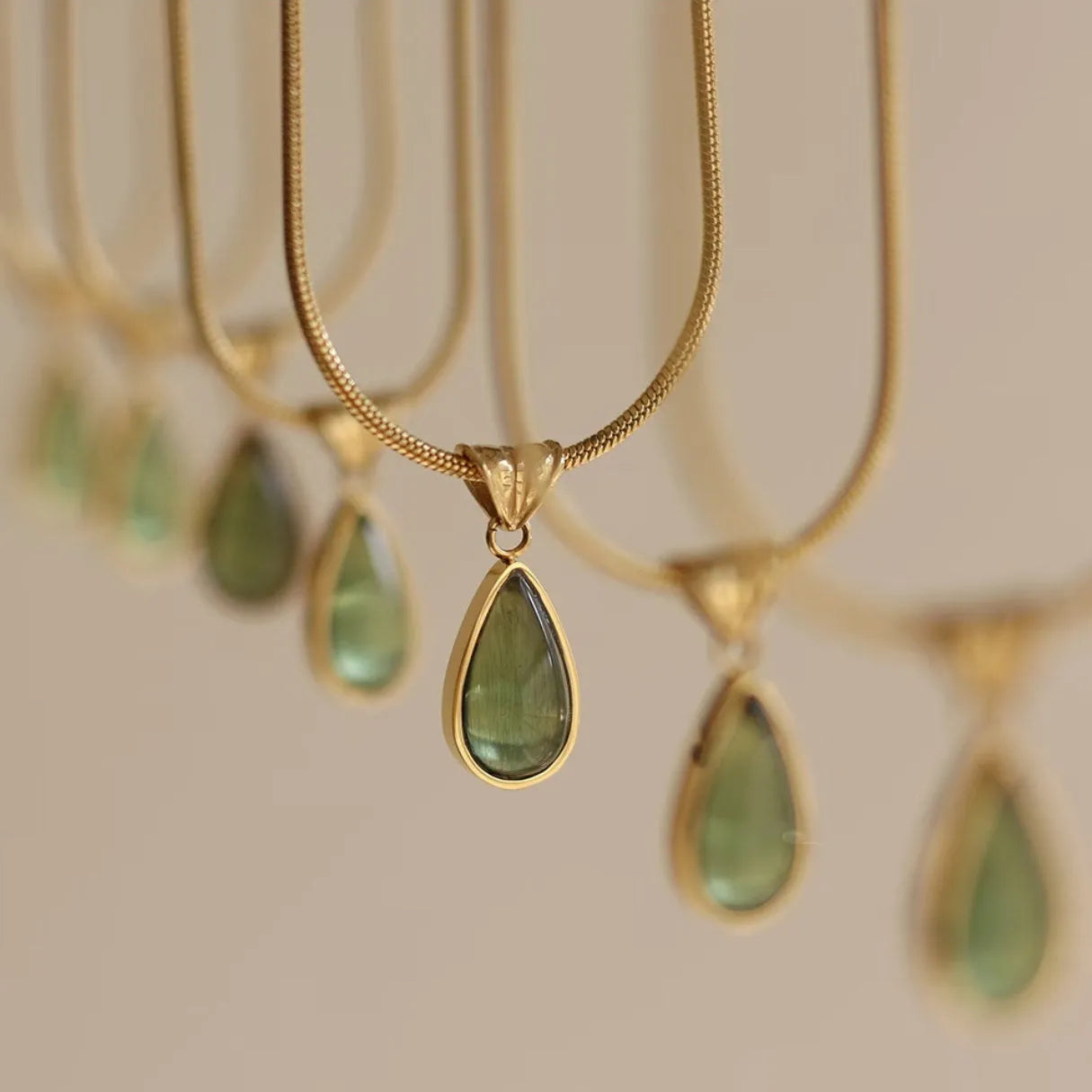 Water drop necklace with mixed gem pendant on titanium snake chain in blue or green.