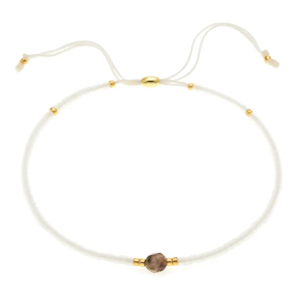 Women's handmade bohemian bracelet with semi-precious stone bead and colourful glass beads.