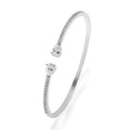 Copper bracelet with inlaid white zircon crystals on a simple band.