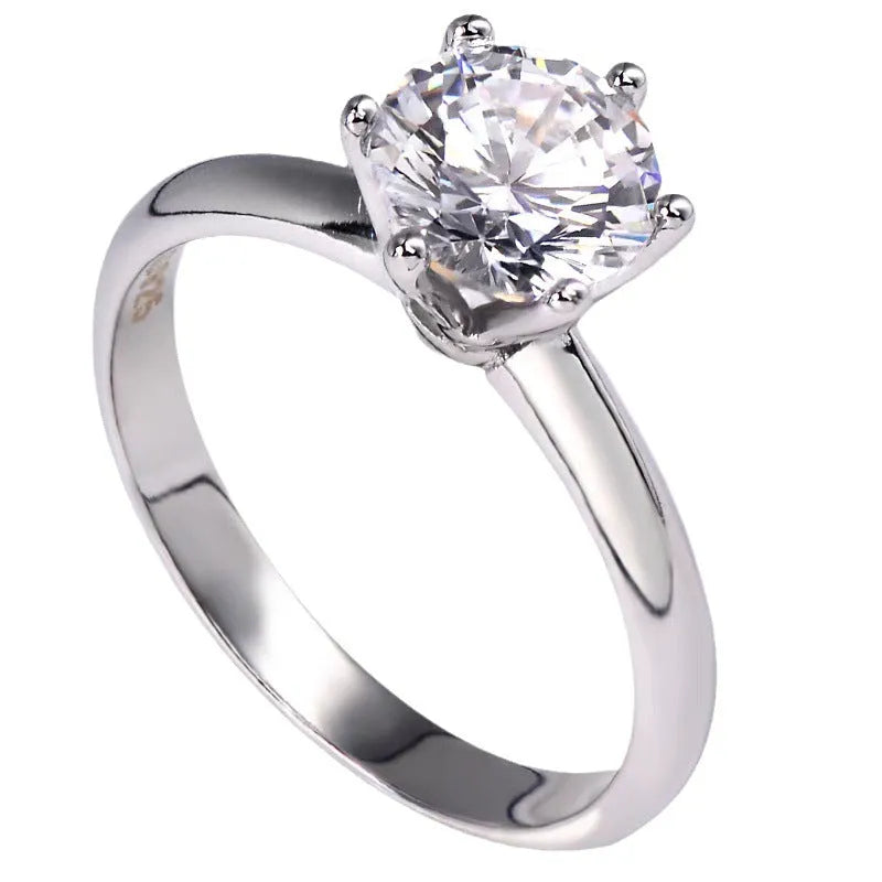 White gold plated women's ring with a geometric zircon stone in a six-claw setting.