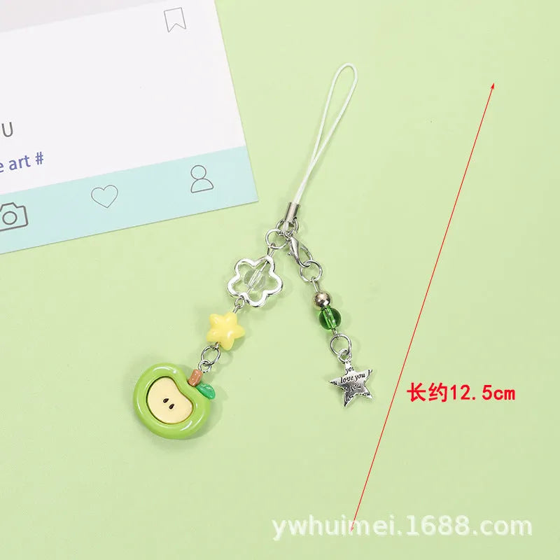 Plastic resin fruit charm keychain with removable rope in strawberry, green apple, and red apple designs.