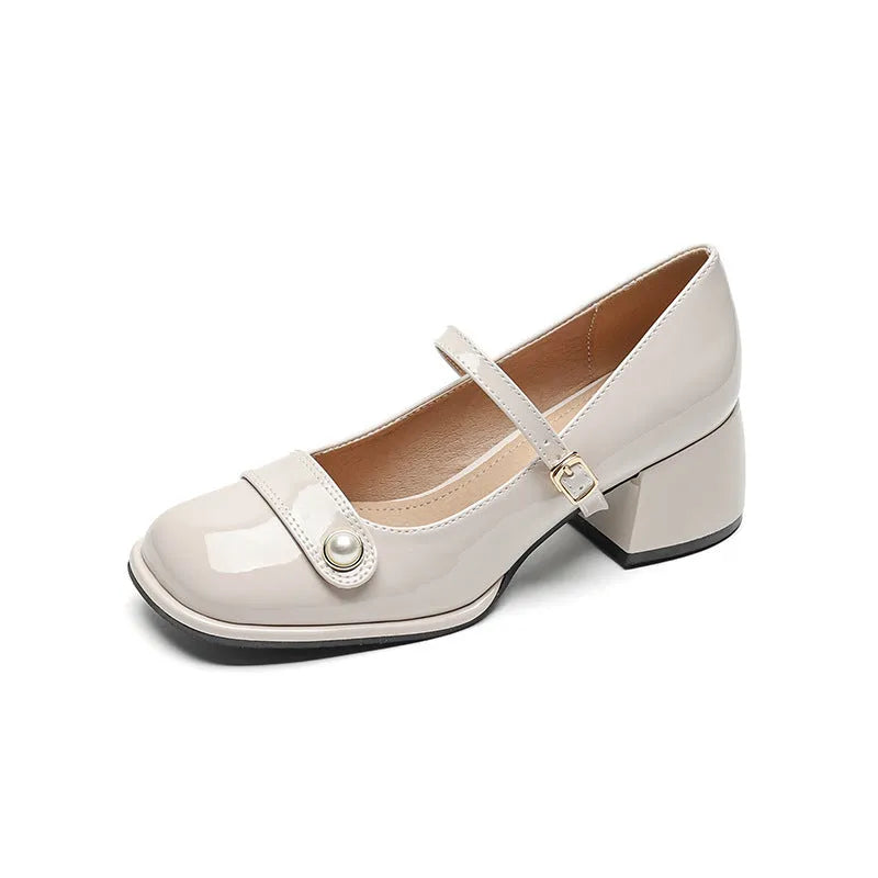 Plus size women's patent leather chunky heel pumps with square toe and buckle fastening in apricot colour.