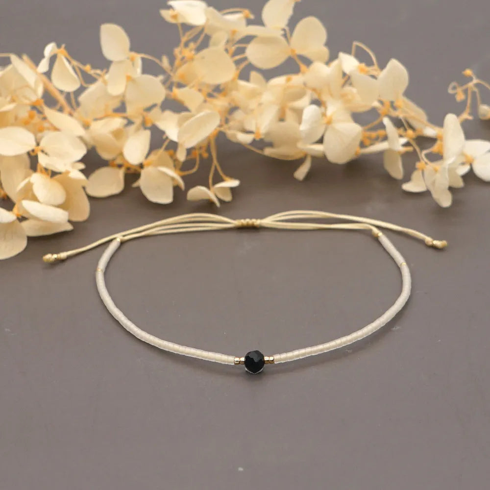 Women's handmade bohemian bracelet with semi-precious stone bead and colourful glass beads.
