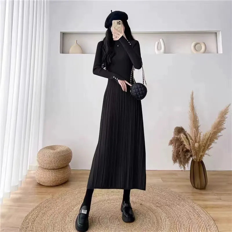 Women's beige high waist A-line knitted midi dress with regular sleeves on a mannequin.